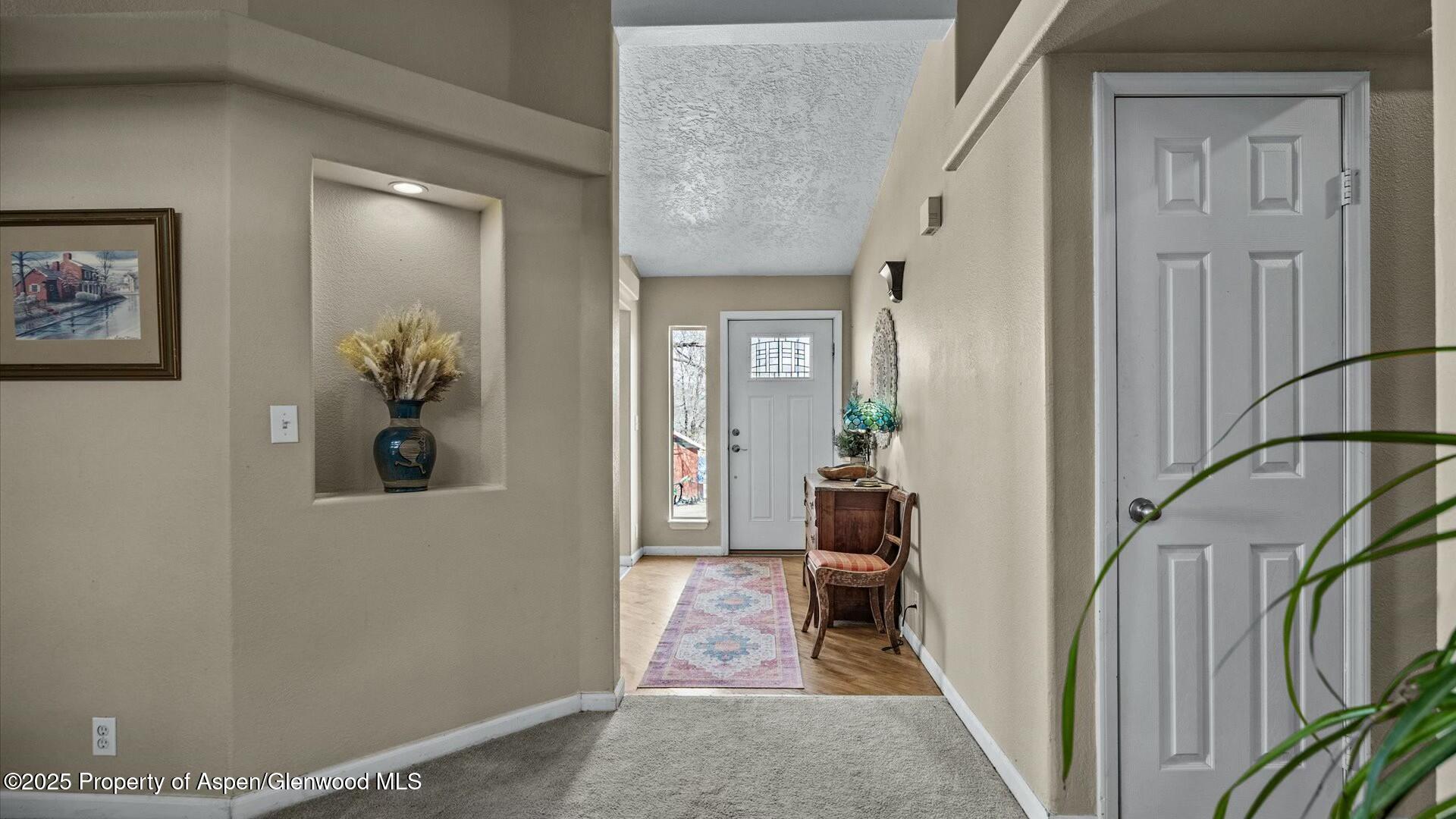 10479 50 Road Mesa, CO 81643 - Photo 5 of 42 a view of a hallway with a livingroom and a dinning room