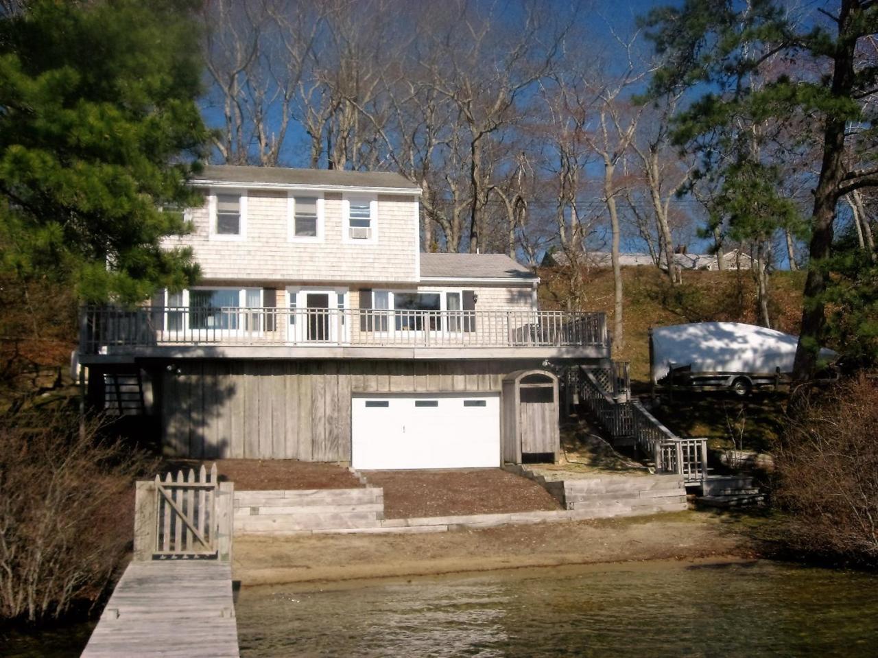 85 Huckins Neck Road Centerville, MA 02632 - Photo 21 of 23 a front view of a house with a ocean view