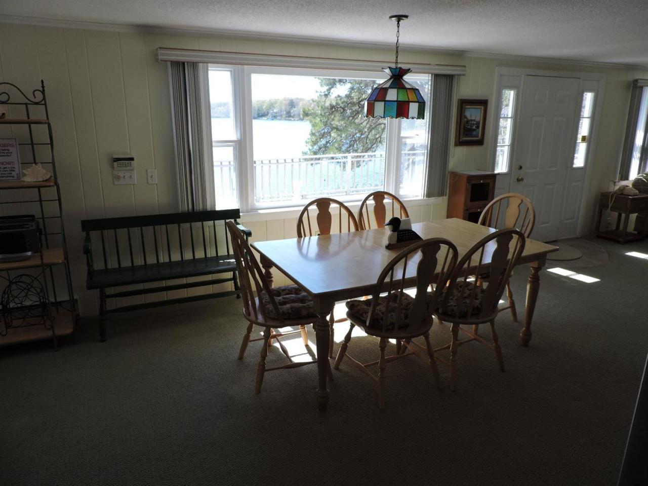 85 Huckins Neck Road Centerville, MA 02632 - Photo 9 of 23 a dining room with furniture window and outside view
