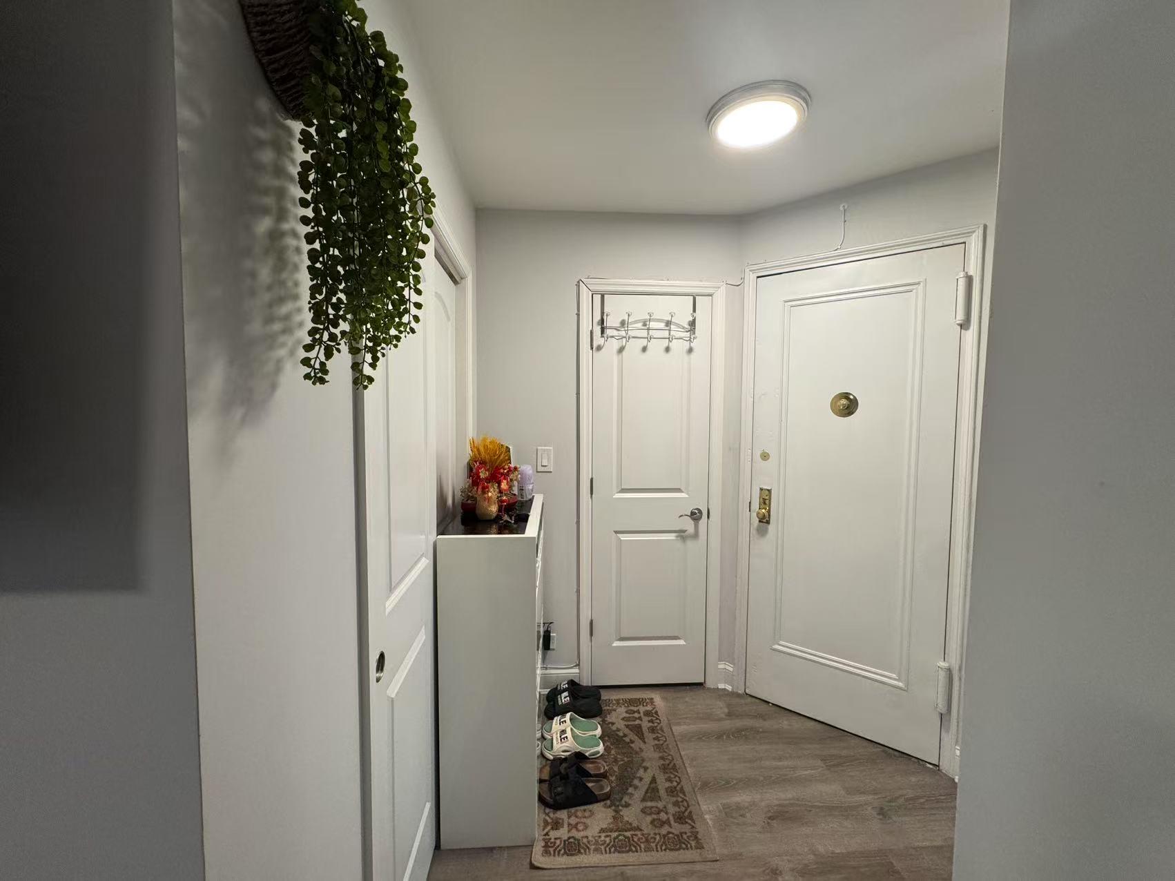 141-13 78th Road, Unit 2M Queens, NY 11367 - Photo 12 of 22 wooden floor in an empty room