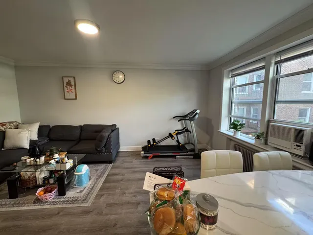 a bedroom with furniture and a gym equipment