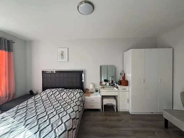 a bedroom with a bed and a table in it