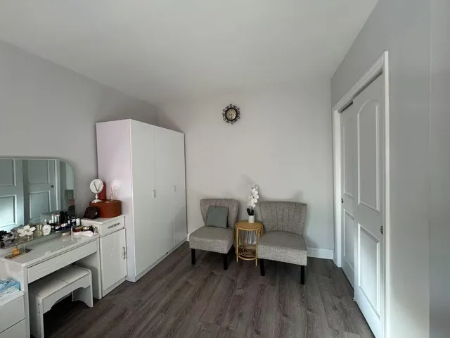 a bathroom with a sink mirror and toilet