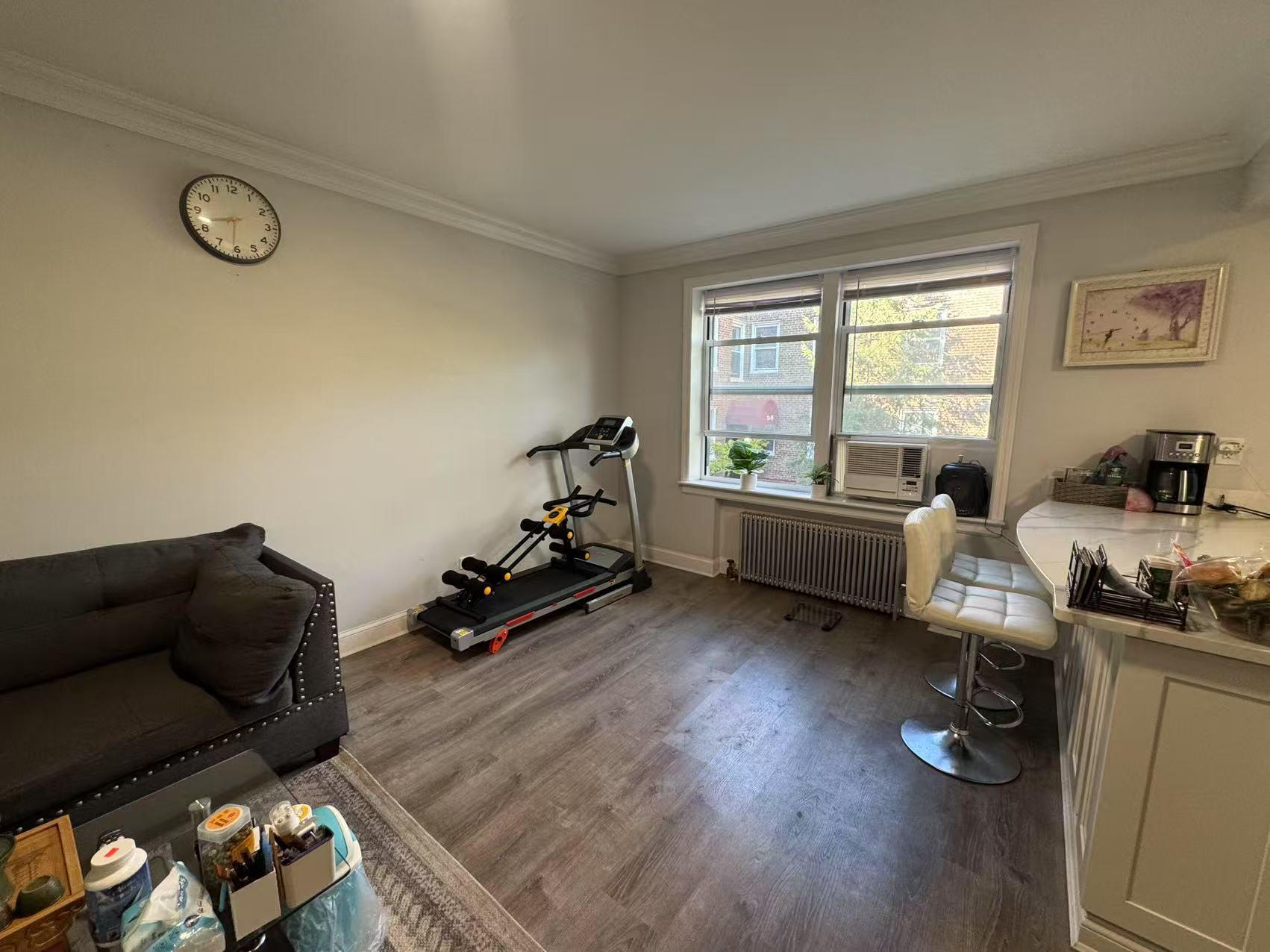 141-13 78th Road, Unit 2M Queens, NY 11367 - Photo 8 of 22 a livingroom with furniture and a window