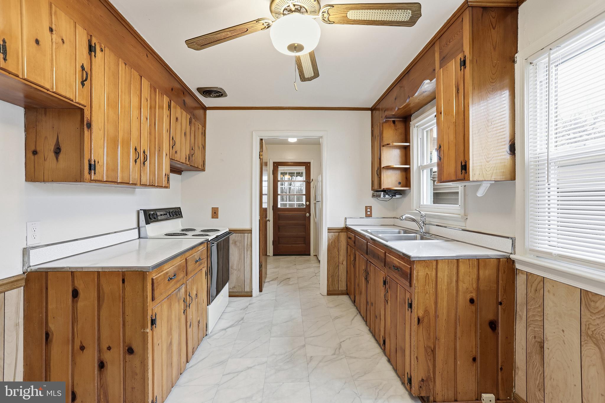 204 Musselman Road Fredericksburg, VA 22405 - Photo 11 of 32 a kitchen with a stove and a sink