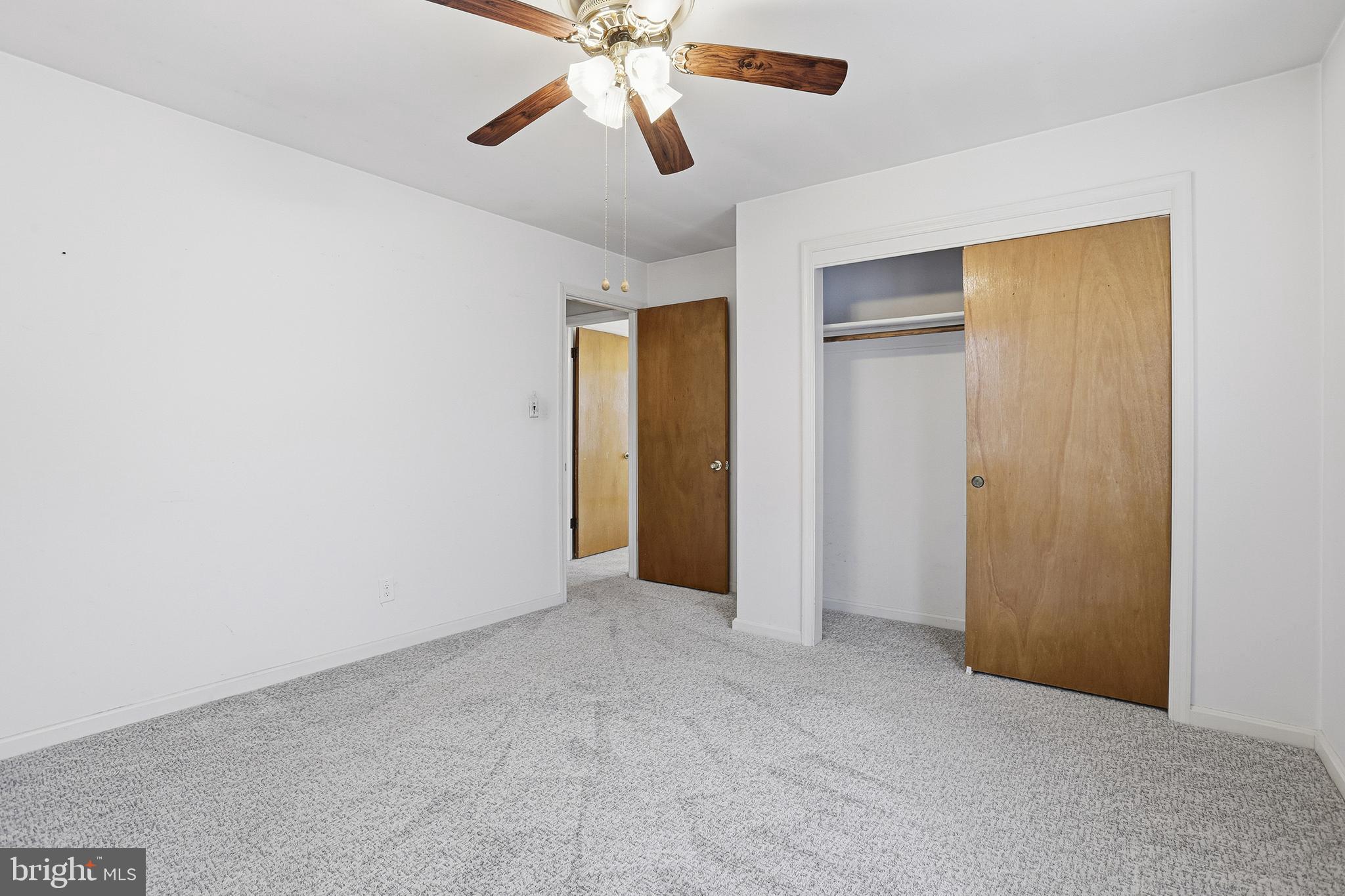 204 Musselman Road Fredericksburg, VA 22405 - Photo 17 of 32 an empty room with closet and a chandelier fan