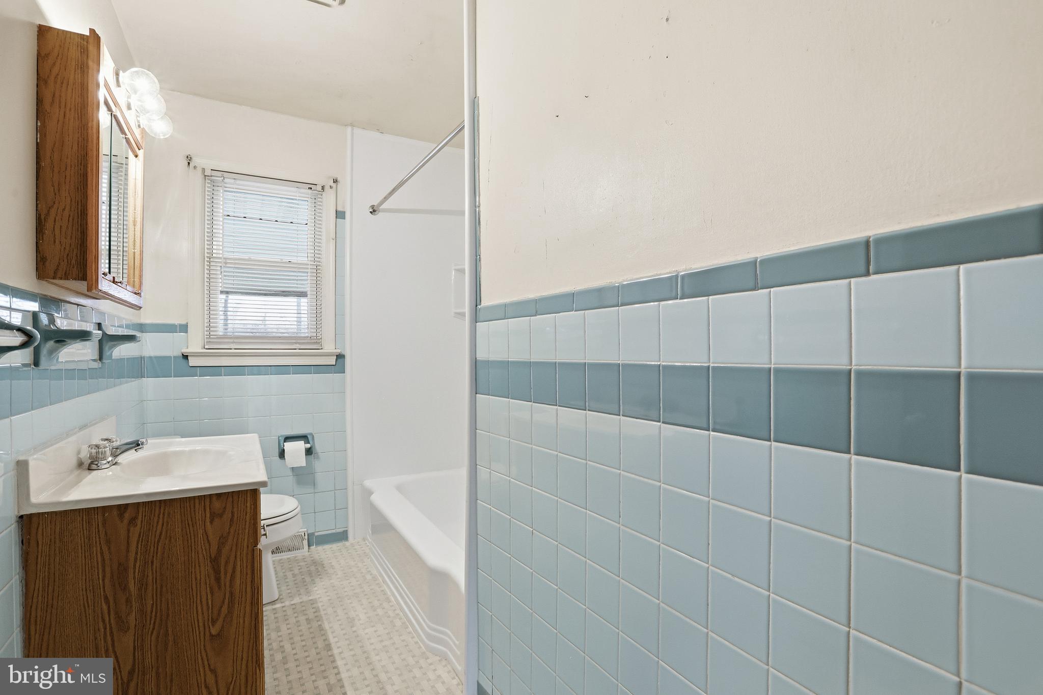 204 Musselman Road Fredericksburg, VA 22405 - Photo 20 of 32 a bathroom with a sink a toilet and shower