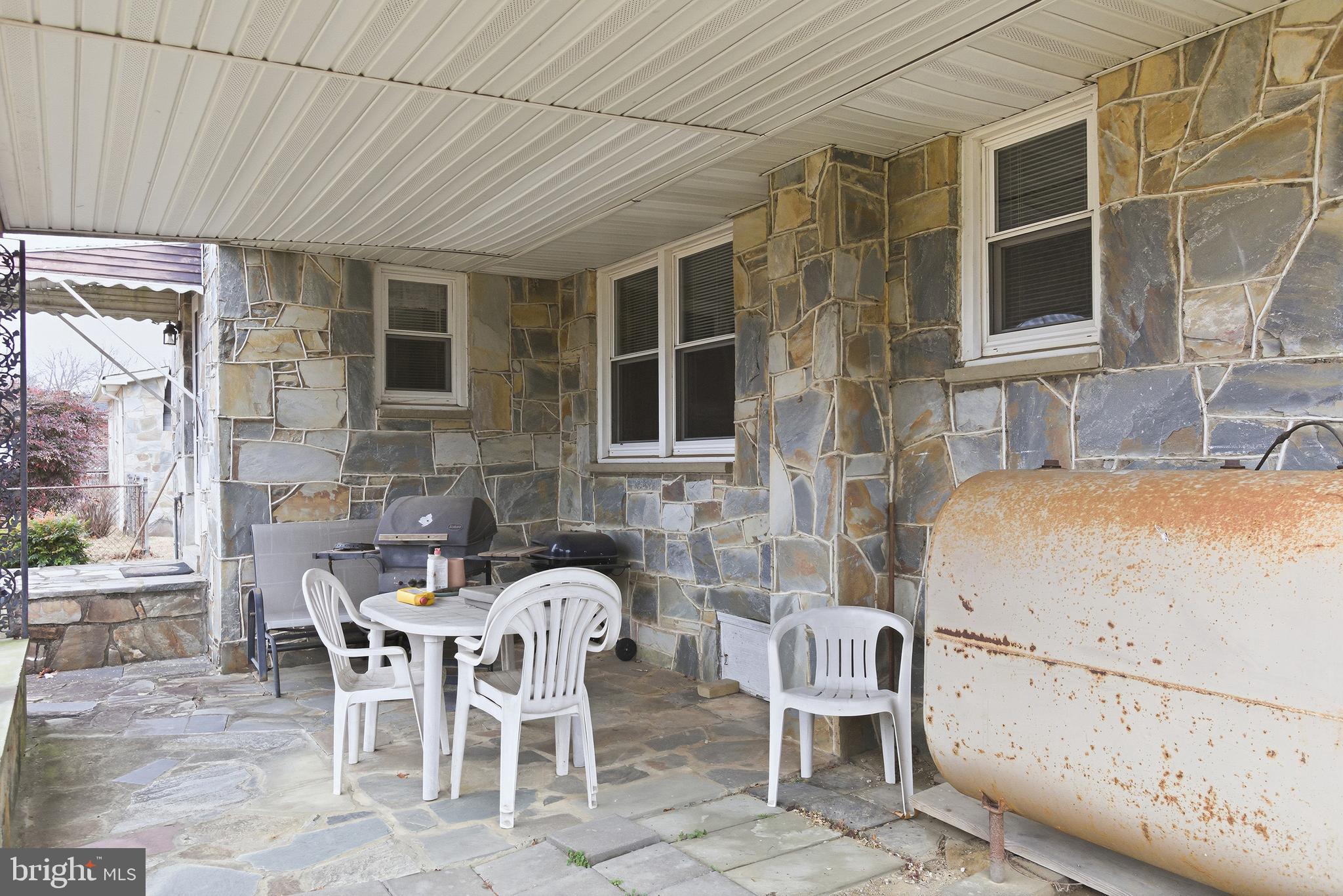 204 Musselman Road Fredericksburg, VA 22405 - Photo 24 of 32 a view of a patio with table and chairs and potted plants
