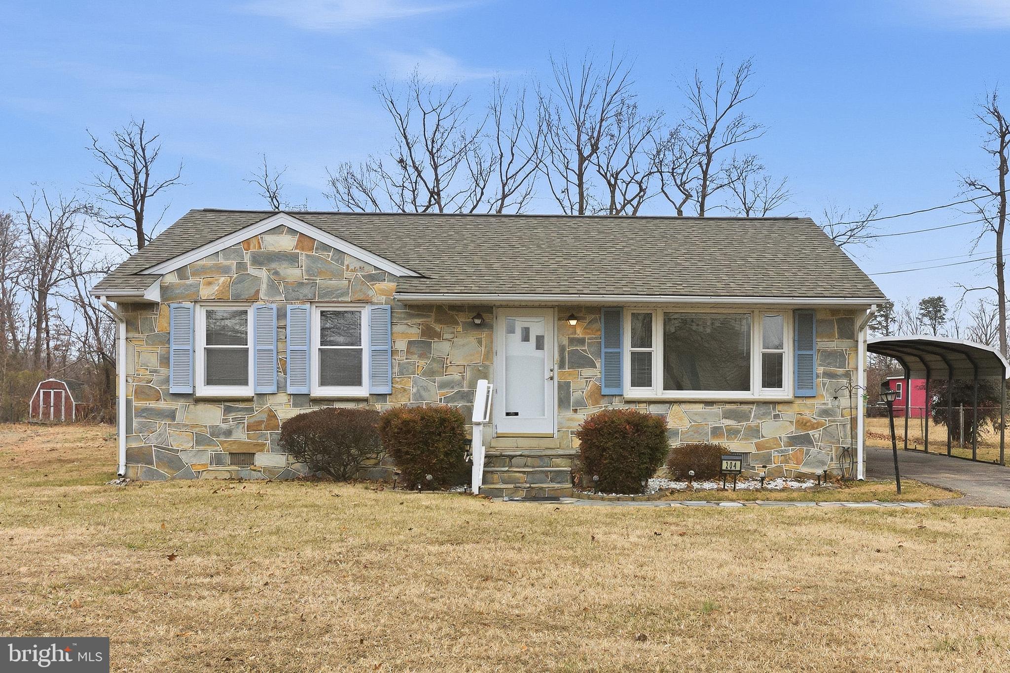 204 Musselman Road Fredericksburg, VA 22405 - Photo 4 of 32 a front view of a house with garden