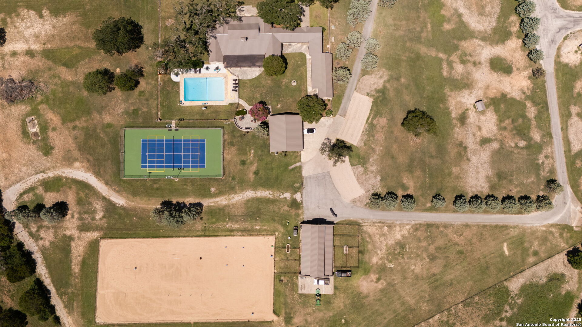 1005 Buckskin Trail Bandera, TX 78003 - Photo 21 of 27 a bathroom with a sink and mirror