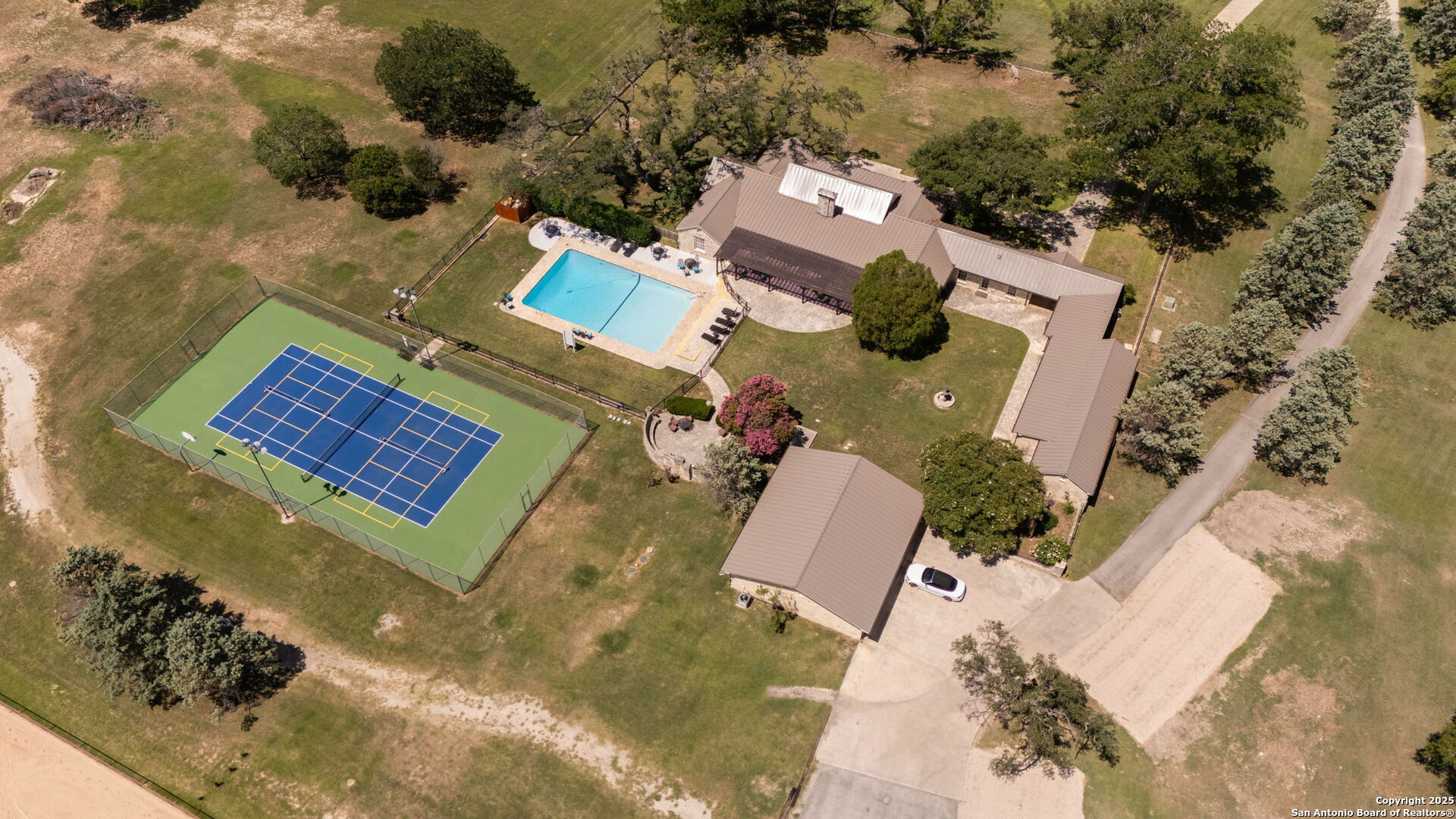 1005 Buckskin Trail Bandera, TX 78003 - Photo 22 of 27 an aerial view of a house with swimming pool and outdoor seating