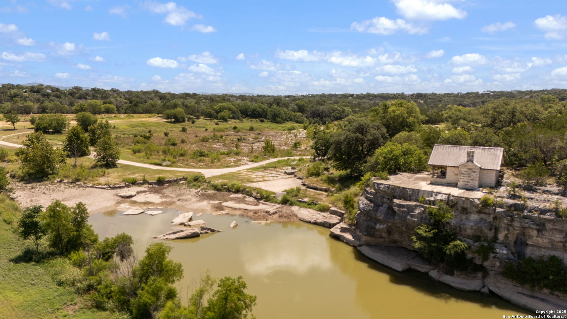 1005 Buckskin Trail Bandera, TX 78003 - Photo 24 of 27 a view of a lake with a mountain