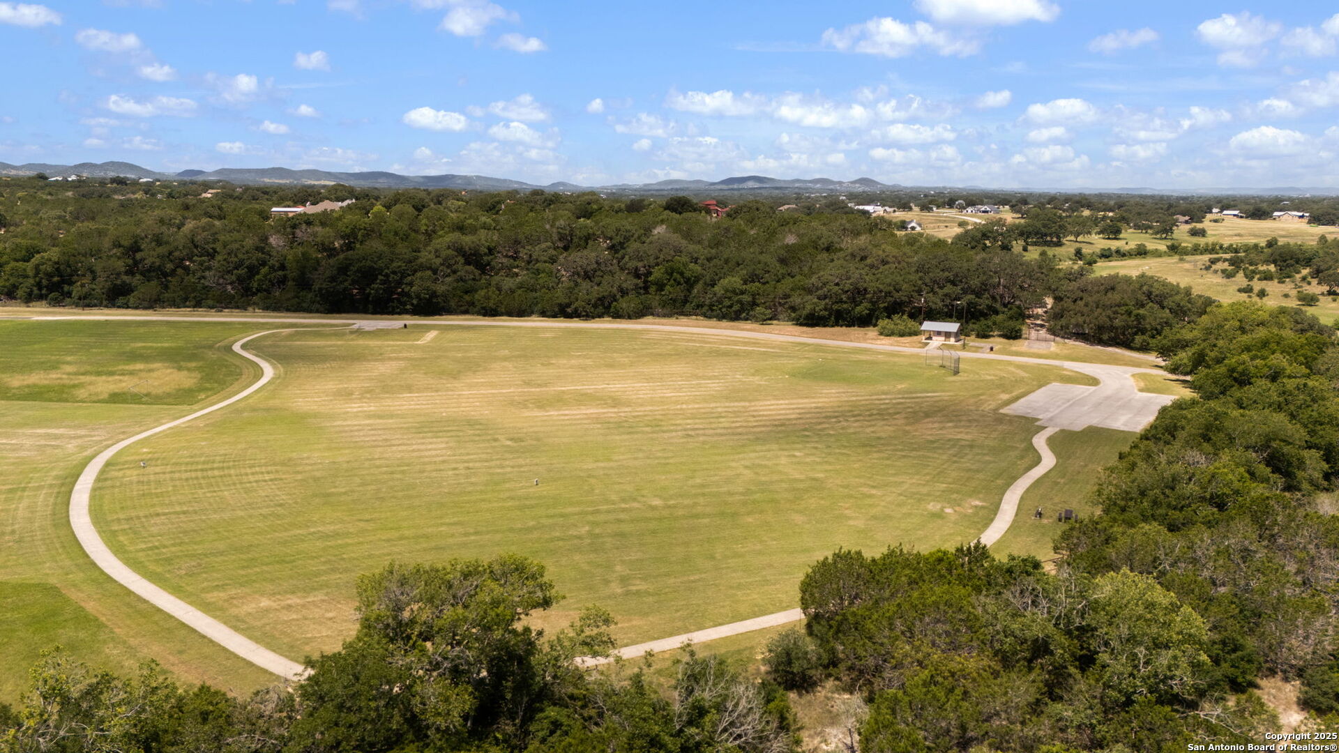 1005 Buckskin Trail Bandera, TX 78003 - Photo 25 of 27 a view of an ocean and a mountain