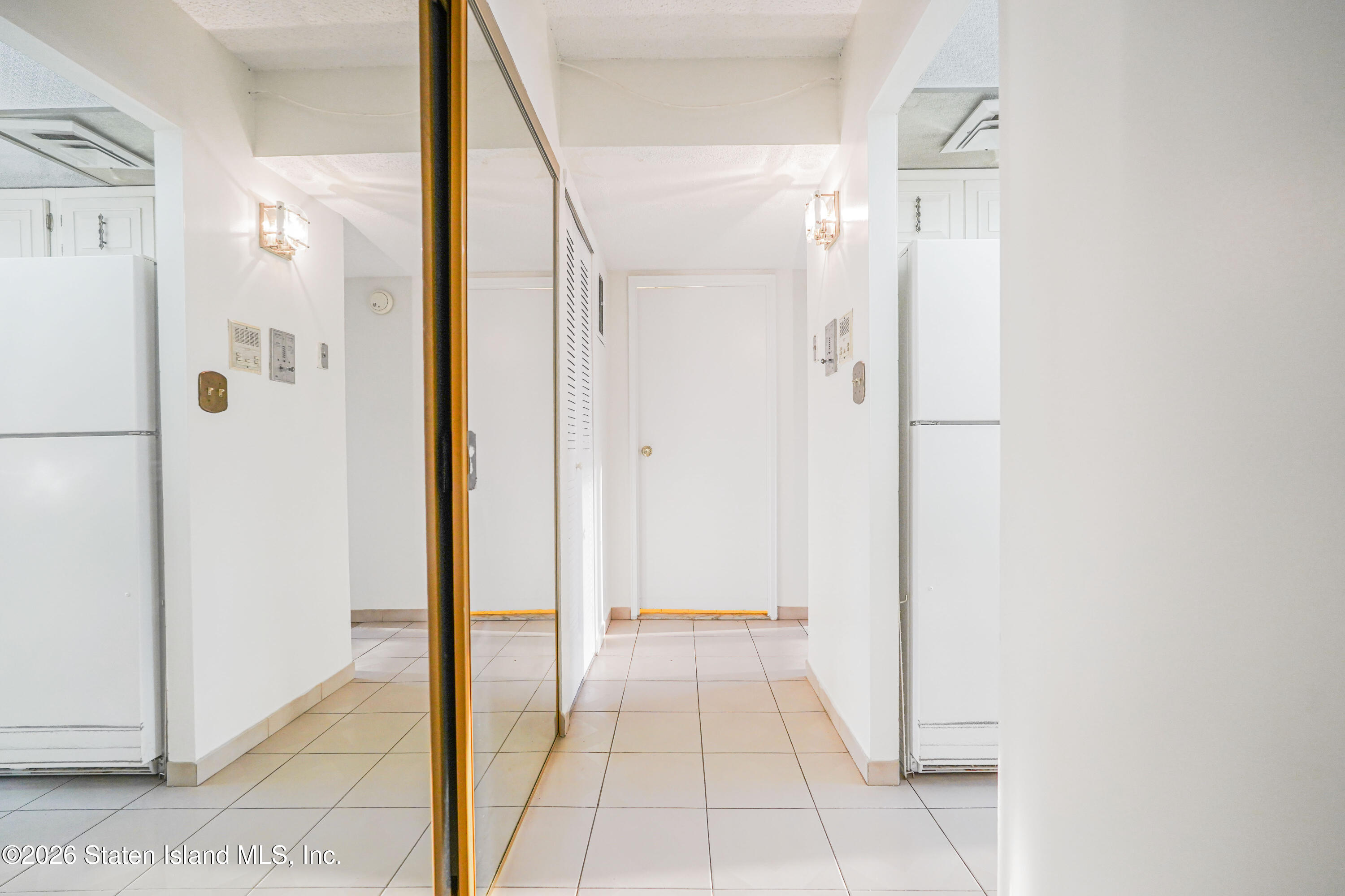 5 Windham Loop, Unit 4M Staten Island, NY 10314 - Photo 21 of 36 a bathroom with a shower and a glass door
