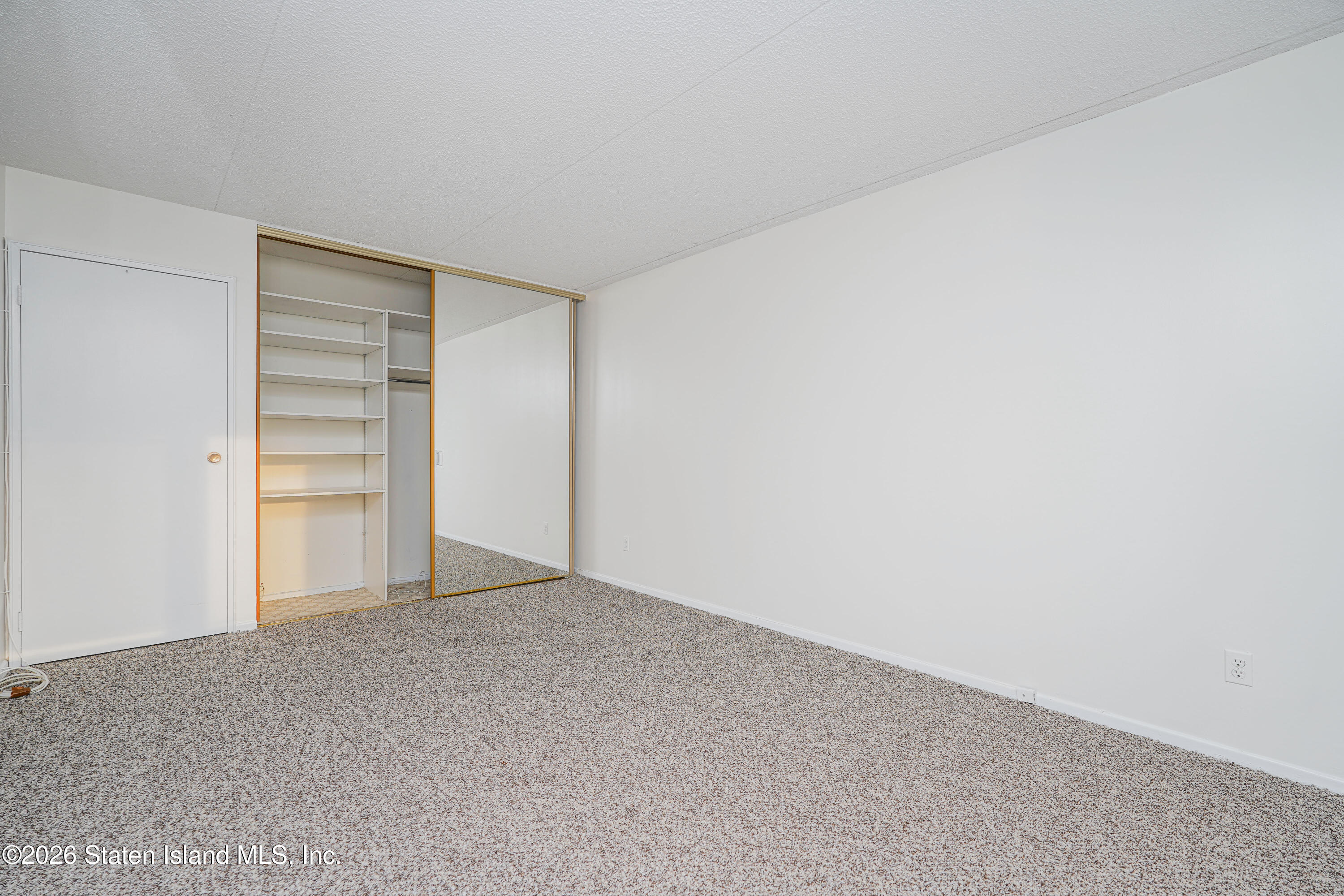 5 Windham Loop, Unit 4M Staten Island, NY 10314 - Photo 27 of 36 BEDROOM CLOSET WALL