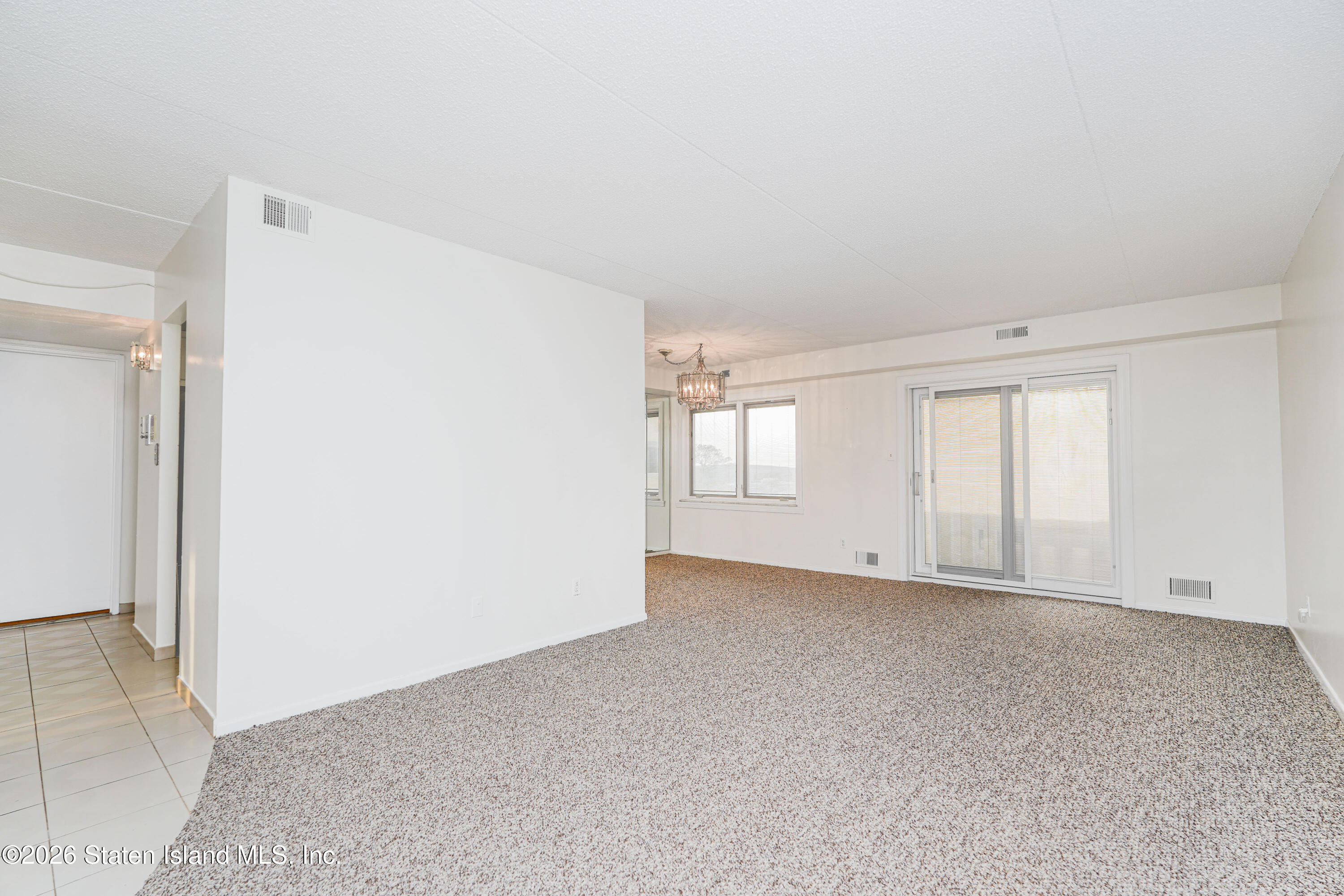 5 Windham Loop, Unit 4M Staten Island, NY 10314 - Photo 8 of 36 LIVING ROOM WITH SLIDERS