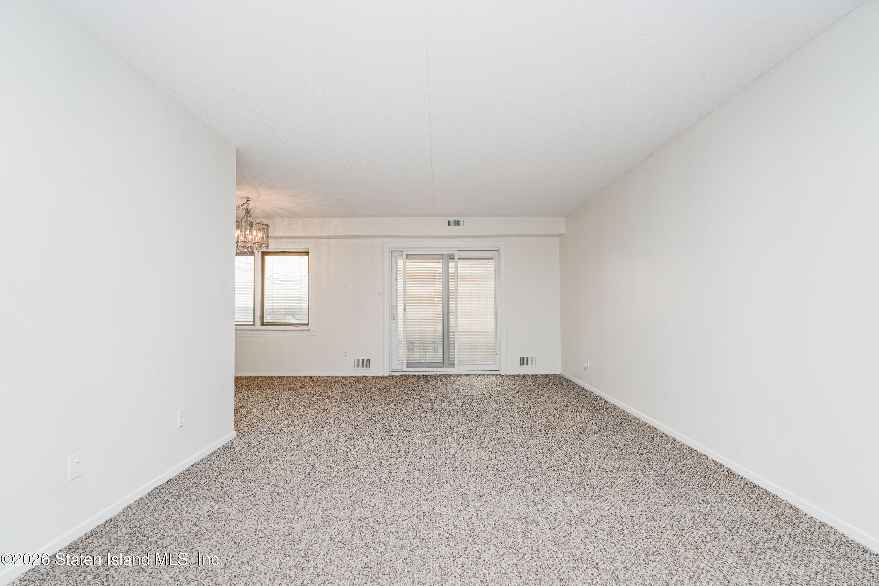 5 Windham Loop, Unit 4M Staten Island, NY 10314 - Photo 9 of 36 a view of an empty room with a window