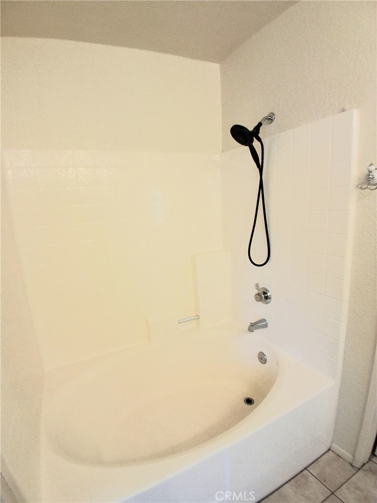 566 East Ave R8 Palmdale, CA 93550 - Photo 19 of 25 a bathroom with a shower