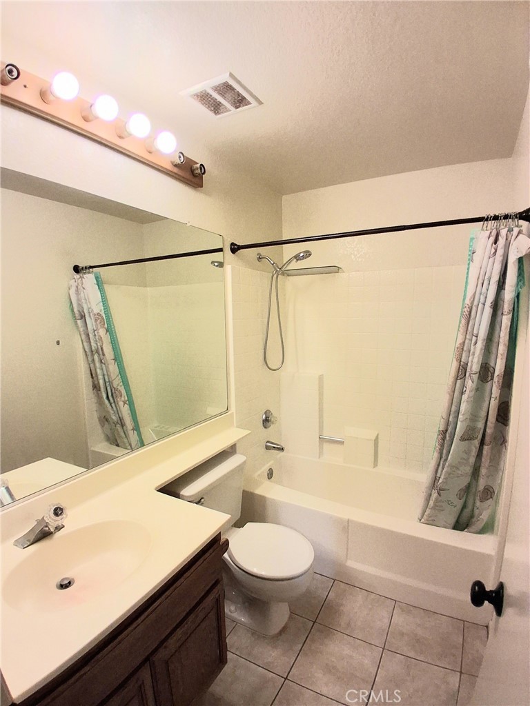 566 East Ave R8 Palmdale, CA 93550 - Photo 21 of 25 a bathroom with a sink a toilet and shower