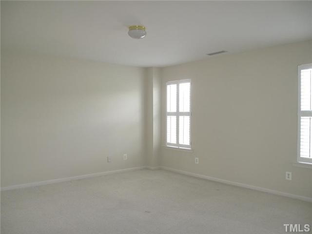 1100 Garnet Ridge Way Raleigh, NC 27607 - Photo 7 of 14 an empty room with windows