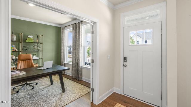 a view of a workspace room with wooden floor windows and wooden floor