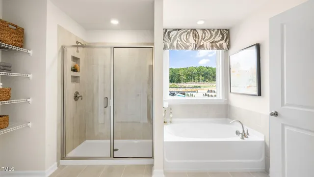 a bathroom with a bathtub and a shower