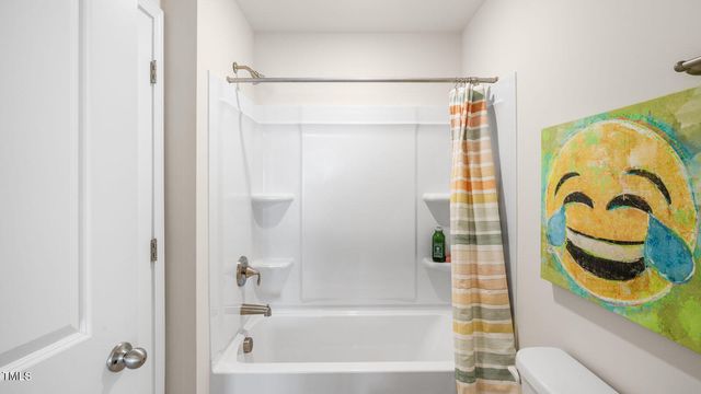 a bathroom with a shower and a bathtub
