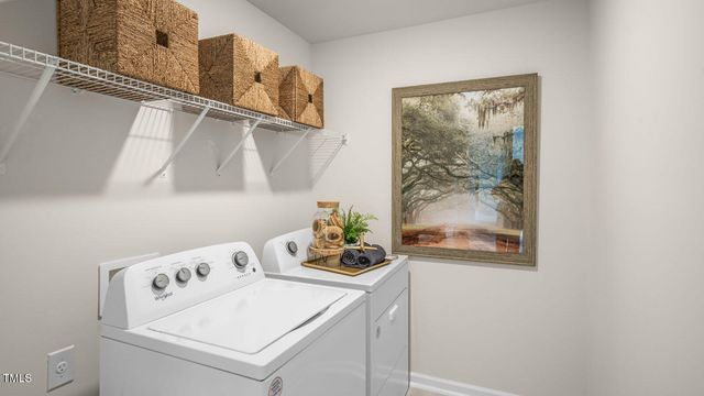 a close up of a wall with a washer and dryer