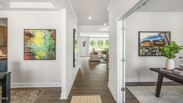 a view of a hallway view with wooden floor and furniture