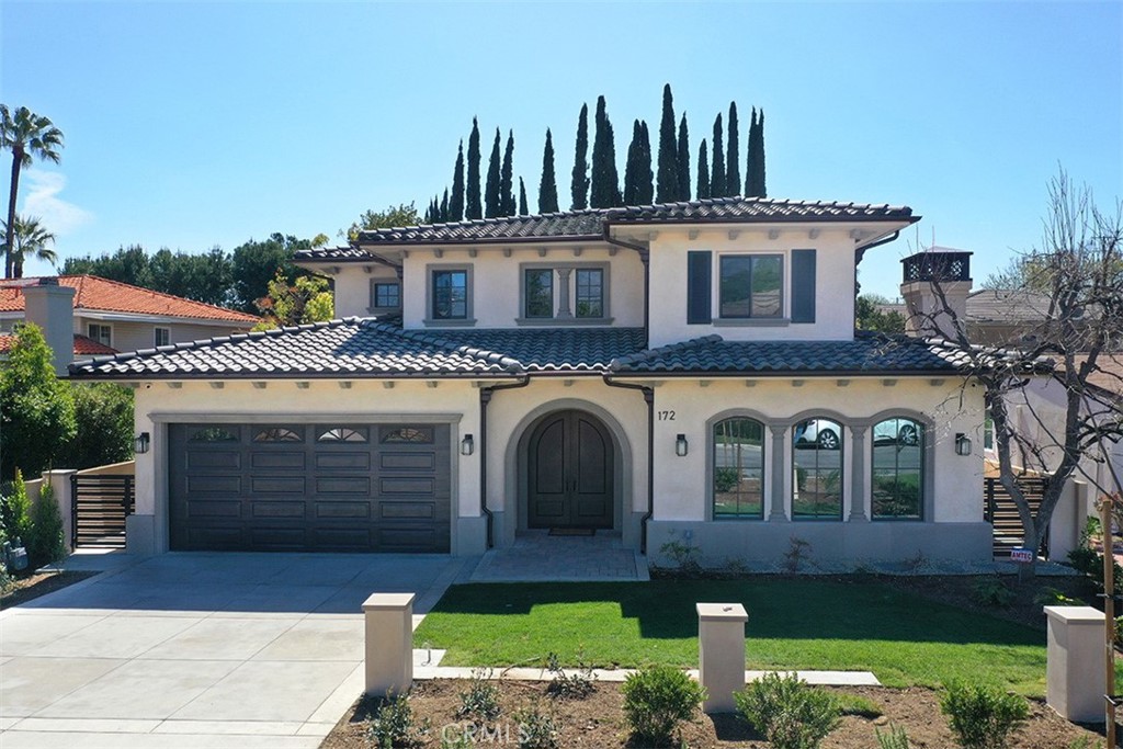 172 West Palm Drive Arcadia, CA 91007 - Photo 2 of 2 a front view of a house with a garden