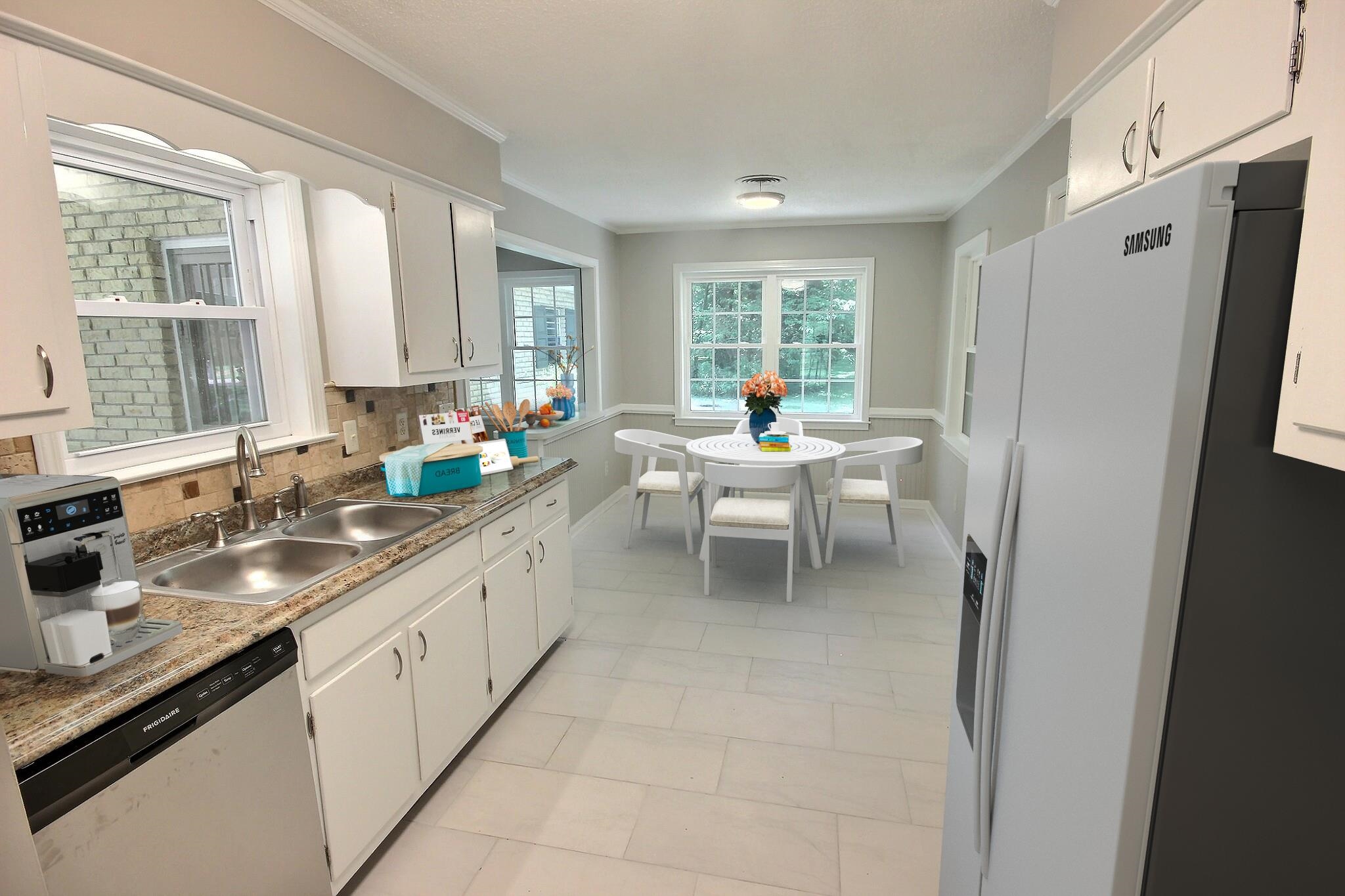 283 Andrew Way Road Collierville, TN 38017 - Photo 6 of 19 a kitchen with a sink and refrigerator