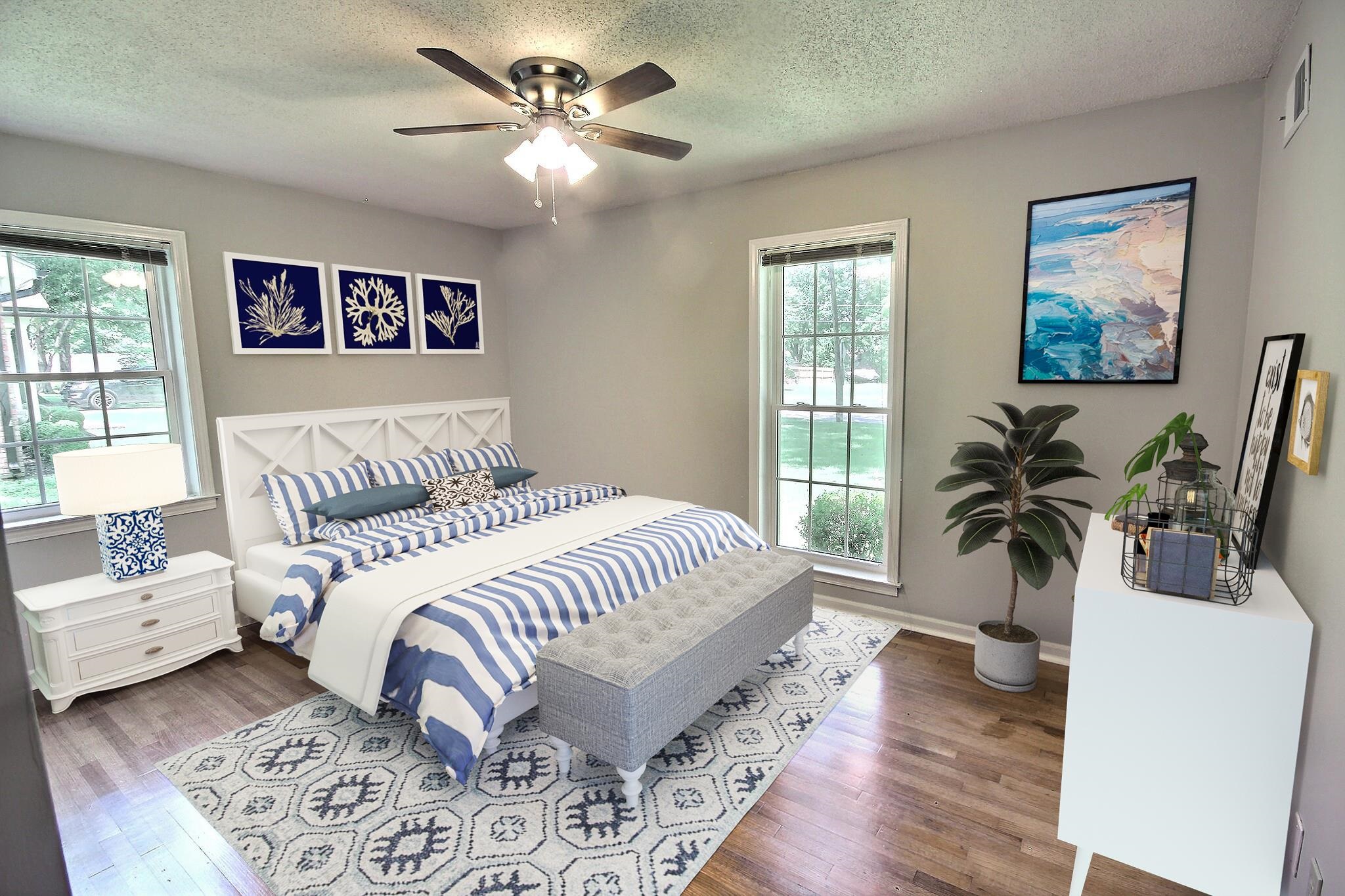 283 Andrew Way Road Collierville, TN 38017 - Photo 8 of 19 a bedroom with a large bed a chandelier and a couch