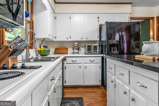 a kitchen with stainless steel appliances granite countertop a sink and dishwasher