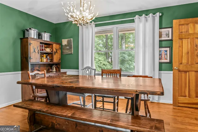 a dining room with furniture and window