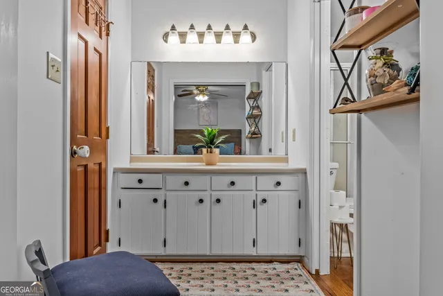 a bathroom with a sink a vanity and a bathtub