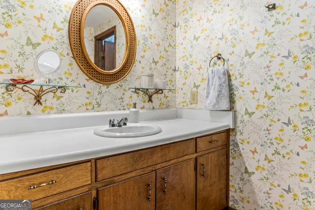 a bathroom with a toilet and a shower curtain