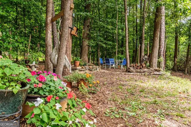 a view of a city with lush green forest