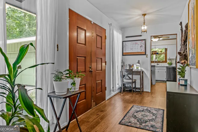 a porch with beautiful table and chairs