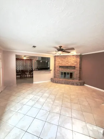 a view of an empty room with a fireplace
