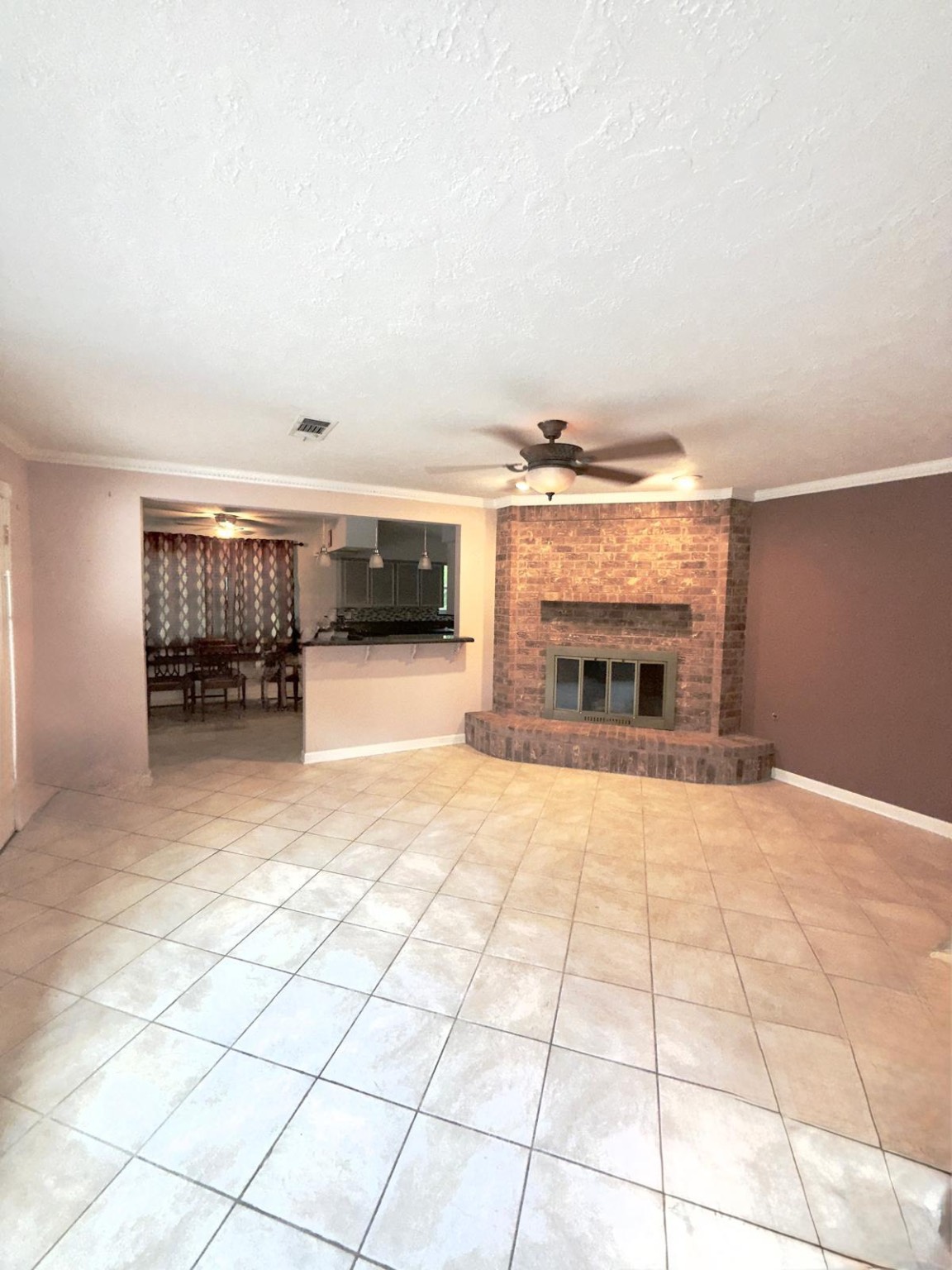 16402 Amcreek Road Houston, TX 77068 - Photo 13 of 32 a view of an empty room with a fireplace