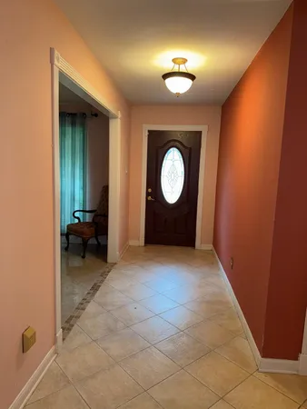 an empty room with a mirror and a sink