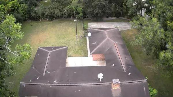 an aerial view of residential house with outdoor space