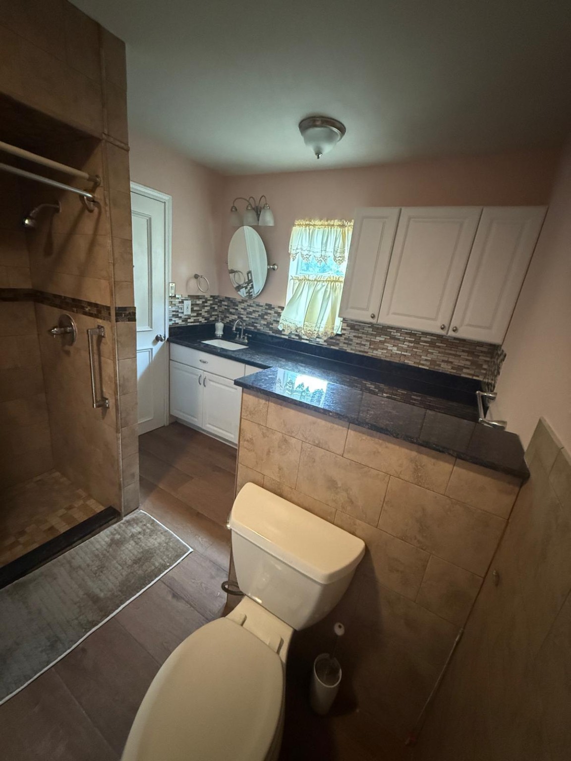 16402 Amcreek Road Houston, TX 77068 - Photo 32 of 32 a bathroom with a sink mirror vanity and toilet