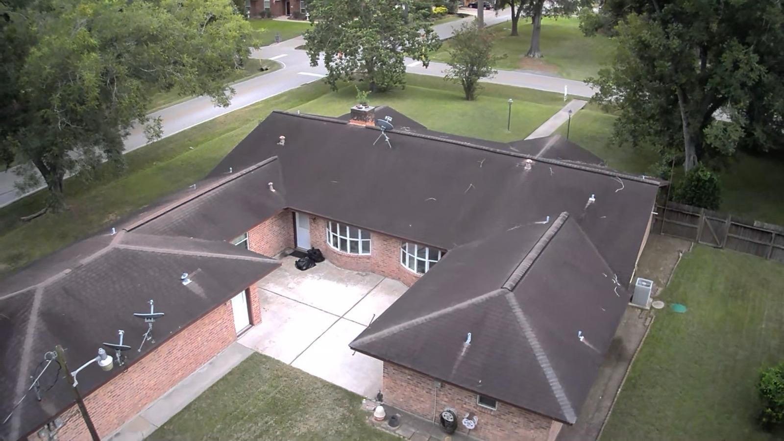 16402 Amcreek Road Houston, TX 77068 - Photo 4 of 32 an aerial view of a house with outdoor space and a lake view