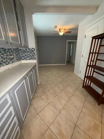 a view of an empty room and stairs