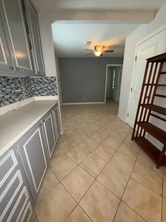 a view of an empty room and stairs