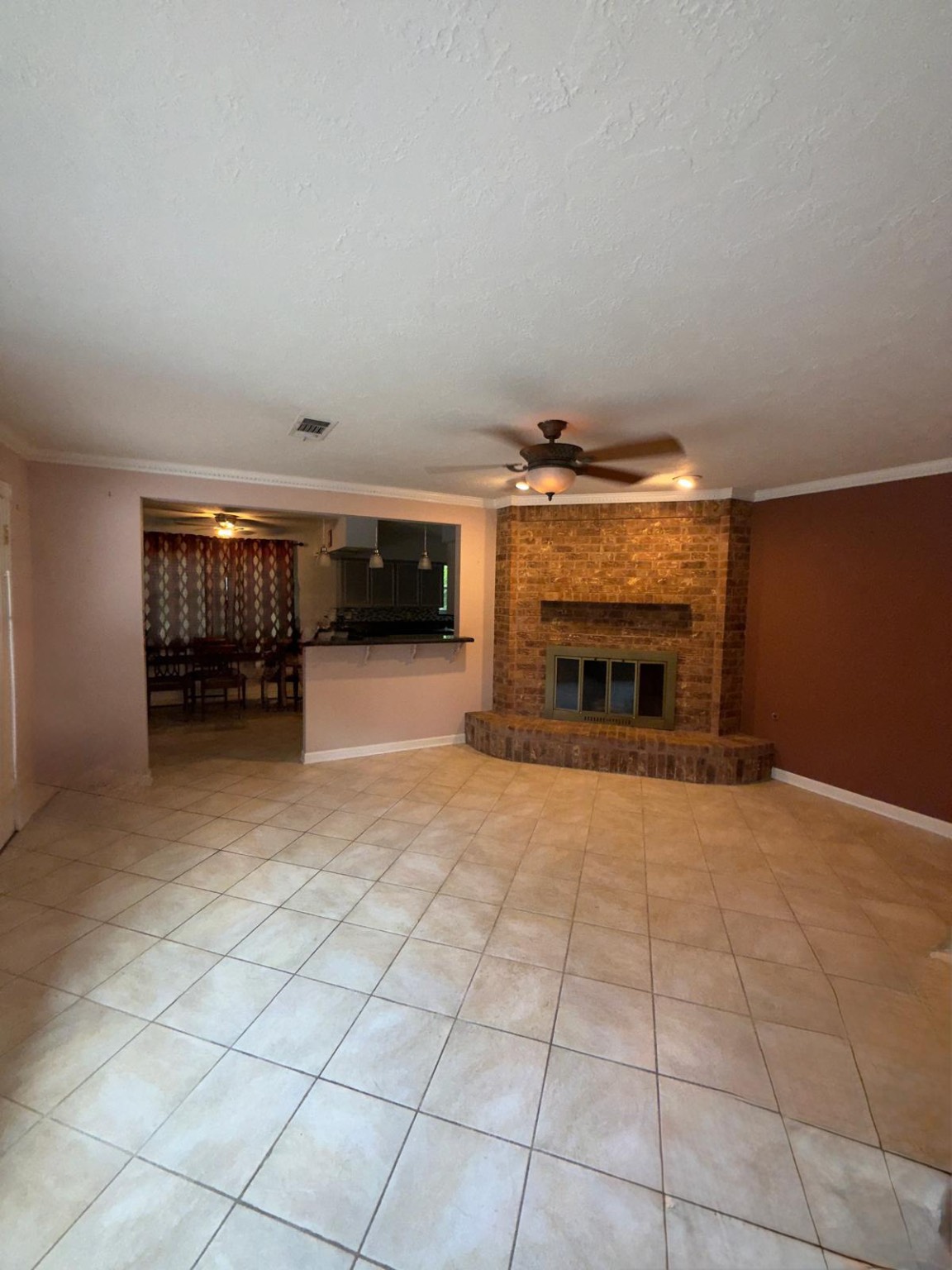 16402 Amcreek Road Houston, TX 77068 - Photo 10 of 32 a view of an empty room with a fireplace
