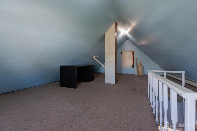 a view of an empty room with stairs