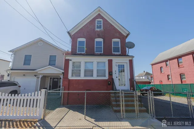 a front view of a house with parking