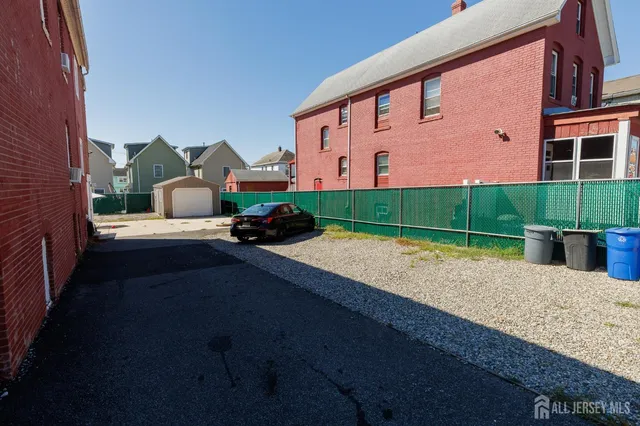 a front view of a house with a garden and yard
